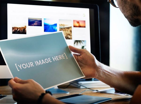 Man Holding Paper or Picture Mockup Man Holding Paper or Picture Mockup
